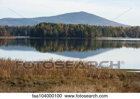 Stock Image - Tranquil lake scene. Fotosearch