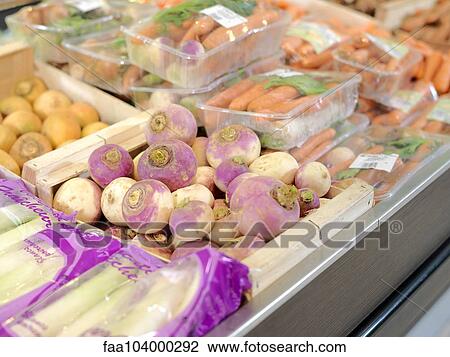 Turnips, carrots and other vegetables on display in grocery store View Large Photo Image Stock Image - Turnips, carrots and other vegetables on display in grocery store. Fotosearch