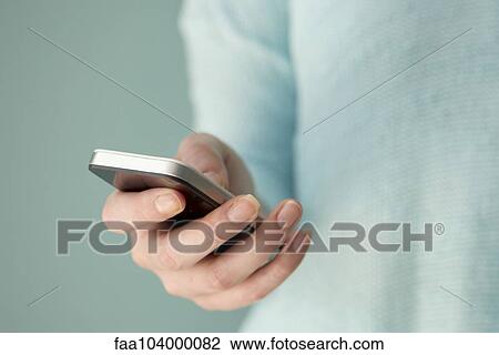 Using smartphone View Large Photo Image Stock Image - Using smartphone. Fotosearch