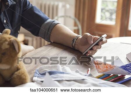 Stock Image - Using smartphone. Fotosearch