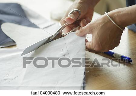 Woman cutting fabric, cropped View Large Photo Image Stock Image - Woman cutting fabric, cropped. Fotosearch