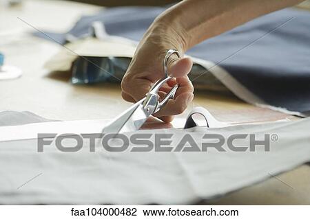Woman cutting fabric, cropped View Large Photo Image Stock Image - Woman cutting fabric, cropped. Fotosearch