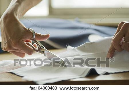 Woman cutting fabric, cropped View Large Photo Image Stock Image - Woman cutting fabric, cropped. Fotosearch