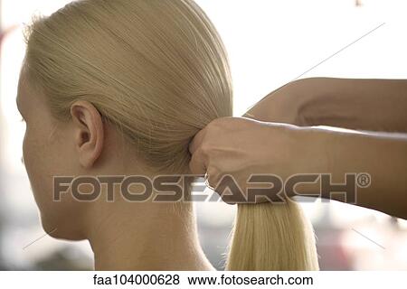 Woman having her hair styled View Large Photo Image Stock Photo - Woman having her hair styled. Fotosearch