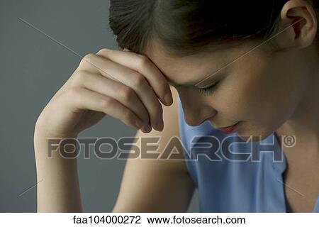 Woman holding head View Large Photo Image Stock Image - Woman holding head. Fotosearch