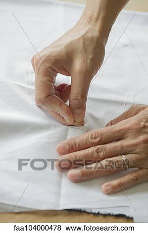 Woman making sewing pattern, cropped View Large Photo Image Stock Photo - Woman making sewing pattern, cropped. Fotosearch