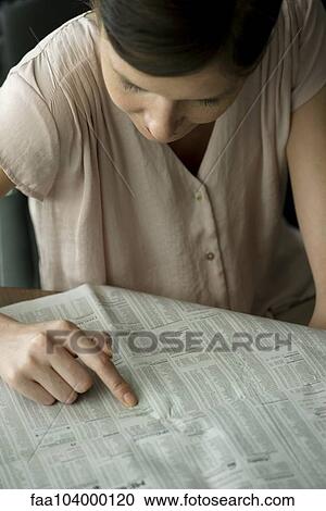 Woman searching job classified ads View Large Photo Image Stock Image - Woman searching job classified ads. Fotosearch
