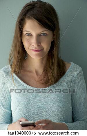 Stock Photography - Woman text messaging. Fotosearch