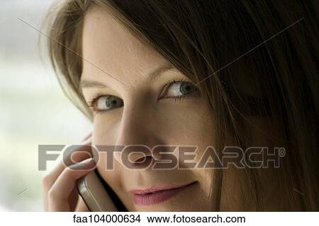 Woman using cell phone View Large Photo Image Picture - Woman using cell phone. Fotosearch