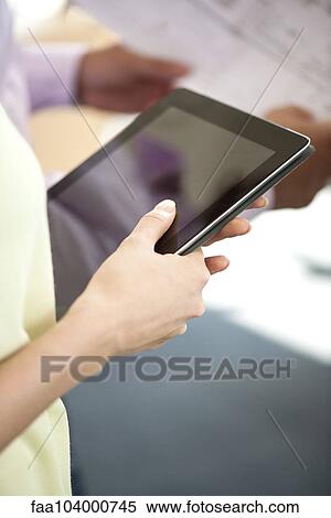 Stock Photography - Woman with digital tablet. Fotosearch