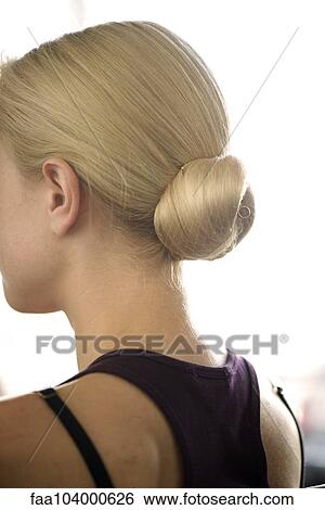 Stock Photograph - Woman with hair arranged in a chignon. Fotosearch