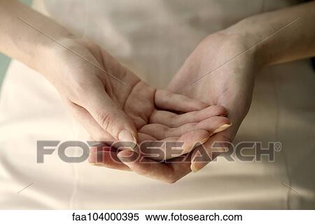 Stock Photography - Woman's cupped hands, close-up. Fotosearch