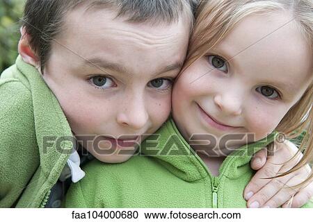 Stock Image - Young siblings, portrait. Fotosearch