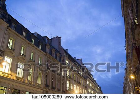 Apartment building at dusk View Large Photo Image Stock Photo - Apartment building at dusk. Fotosearch