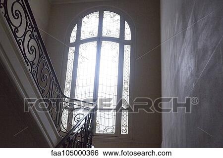 Arched window at top of stairs View Large Photo Image Stock Photograph - Arched window at top of stairs. Fotosearch