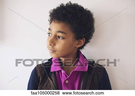 Boy looking away in thought, portrait View Large Photo Image Stock Photo - Boy looking away in thought, portrait. Fotosearch