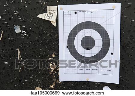 Bullet holes in shooting target View Large Photo Image Stock Photo - Bullet holes in shooting target. Fotosearch