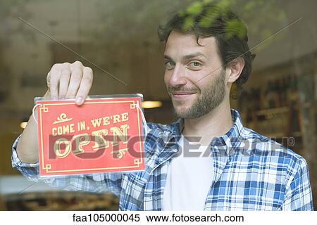 Business owner opening shop for the day View Large Photo Image Stock Photography - Business owner opening shop for the day. Fotosearch