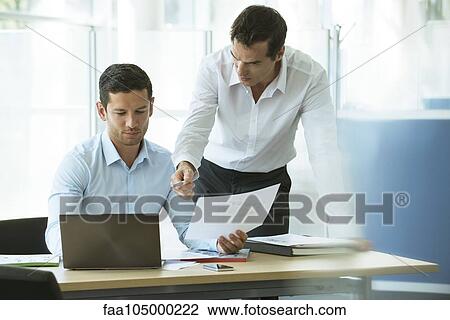 Stock Image - Business professionals collaborating. Fotosearch