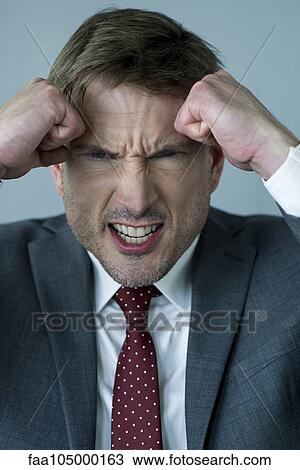 Businessman clenching fists in anger View Large Photo Image Stock Image - Businessman clenching fists in anger. Fotosearch