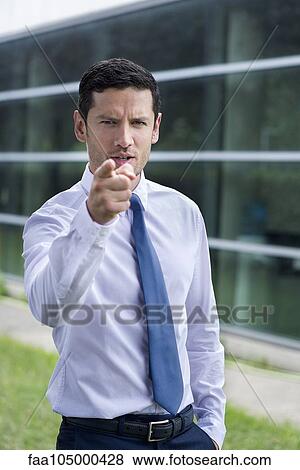 Stock Photo - Businessman pointing finger in accusation. Fotosearch