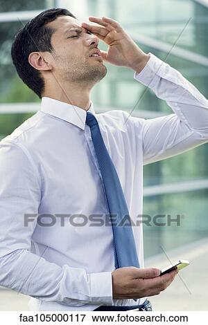 Businessman receiving bad news View Large Photo Image Stock Photo - Businessman receiving bad news. Fotosearch