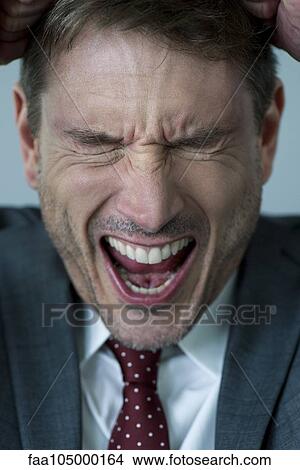 Businessman shouting in frustration View Large Photo Image Picture - Businessman shouting in frustration. Fotosearch