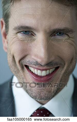 Businessman smiling cheerfully, portrait View Large Photo Image Stock Photography - Businessman smiling cheerfully, portrait. Fotosearch