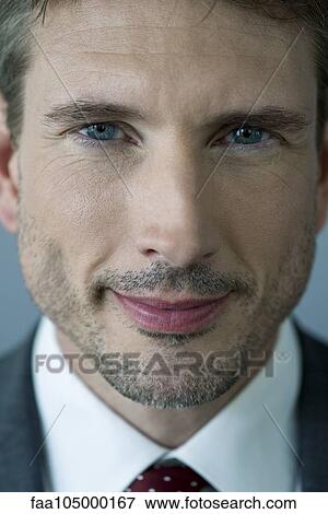 Businessman smiling, close-up portrait View Large Photo Image Stock Photo - Businessman smiling, close-up portrait. Fotosearch