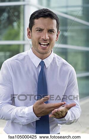 Stock Photography - Businessman talking angrily. Fotosearch