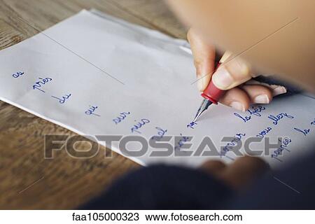 Child writing in cursive on paper, cropped View Large Photo Image Stock Image - Child writing in cursive on paper, cropped. Fotosearch