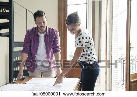 Colleagues collaborating on project View Large Photo Image Stock Image - Colleagues collaborating on project. Fotosearch