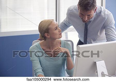 Colleagues collaborating View Large Photo Image Picture - Colleagues collaborating. Fotosearch