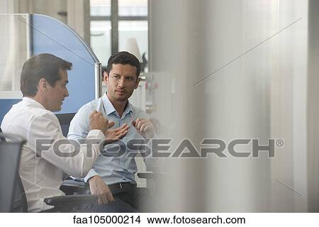 Picture - Colleagues discussing innovative solution to everyday problem. Fotosearch