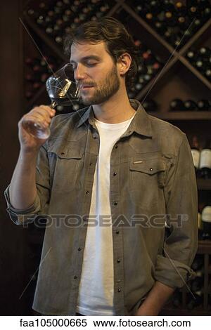 Connoisseur smelling glass of wine View Large Photo Image Stock Photography - Connoisseur smelling glass of wine. Fotosearch