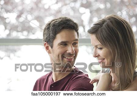 Stock Photo - Couple smiling together. Fotosearch