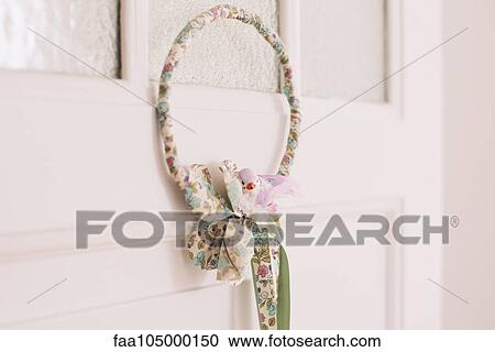 Decorative wreath hanging on door View Large Photo Image Stock Image - Decorative wreath hanging on door. Fotosearch