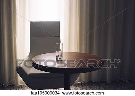 Empty glass on hotel room table View Large Photo Image Picture - Empty glass on hotel room table. Fotosearch