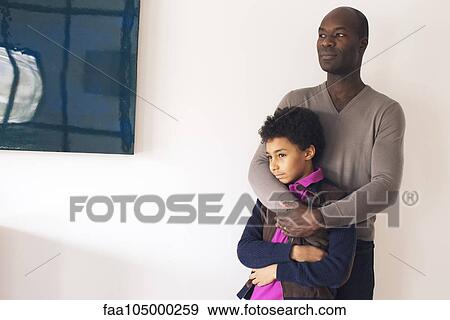 Father embracing son View Large Photo Image Stock Photo - Father embracing son. Fotosearch