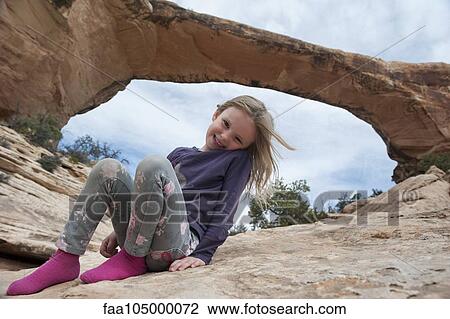 Girl sitting near Owachomo Bridge, Natural Bridges National Monument, Utah, USA View Large Photo Image Stock Image - Girl sitting near Owachomo Bridge, Natural Bridges National Monument, Utah, USA. Fotosearch
