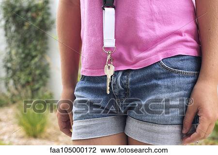 Girl wearing key around her neck, cropped View Large Photo Image Stock Image - Girl wearing key around her neck, cropped. Fotosearch