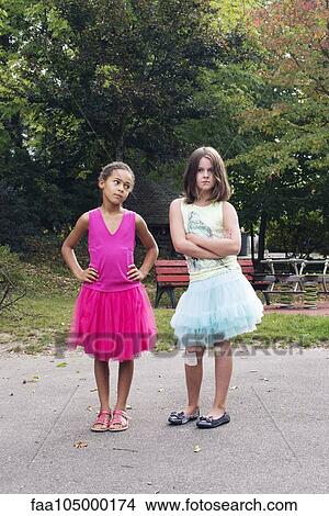 Girls dressed in tutus with tough expression on faces View Large Photo Image Picture - Girls dressed in tutus with tough expression on faces. Fotosearch
