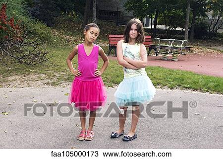 Girls dressed in tutus with tough expression on faces View Large Photo Image Stock Image - Girls dressed in tutus with tough expression on faces. Fotosearch