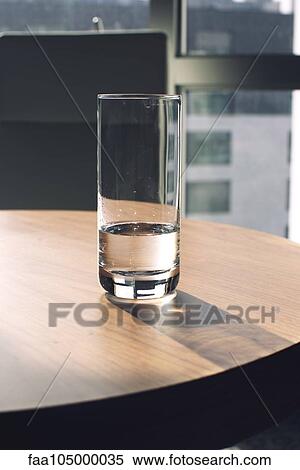 Glass of water on table View Large Photo Image Stock Photography - Glass of water on table. Fotosearch