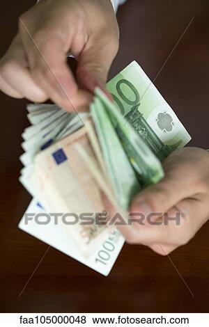 Hands counting stack of cash View Large Photo Image Stock Photo - Hands counting stack of cash. Fotosearch
