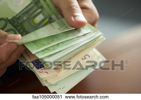 Hands countong stack of money, cropped View Large Photo Image Stock Image - Hands countong stack of money, cropped. Fotosearch