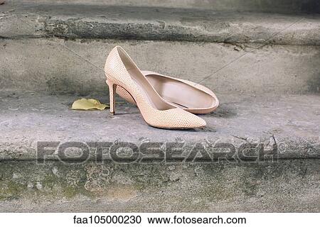 High heel dress shoes left on stairs View Large Photo Image Stock Image - High heel dress shoes left on stairs. Fotosearch