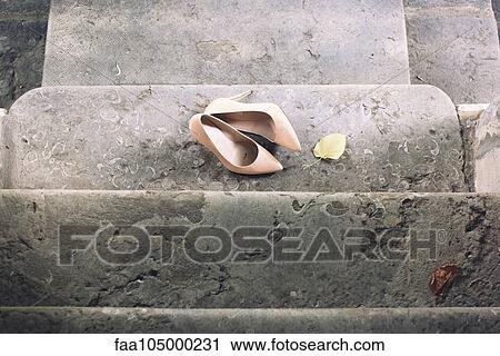 High heel dress shoes left on stairs View Large Photo Image Stock Image - High heel dress shoes left on stairs. Fotosearch