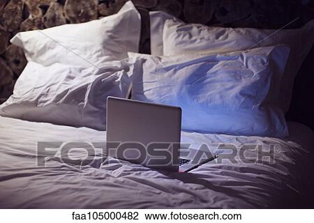 Laptop computer on bed View Large Photo Image Stock Image - Laptop computer on bed. Fotosearch