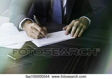 Lawyer addressing envelope View Large Photo Image Picture - Lawyer addressing envelope. Fotosearch